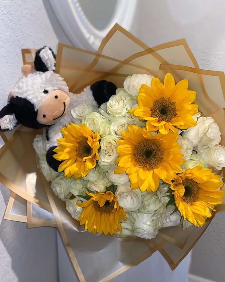 Sunflowers with a cow
